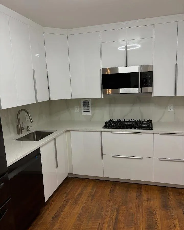 Restored kitchen with white cabinets after water damage in Hartford